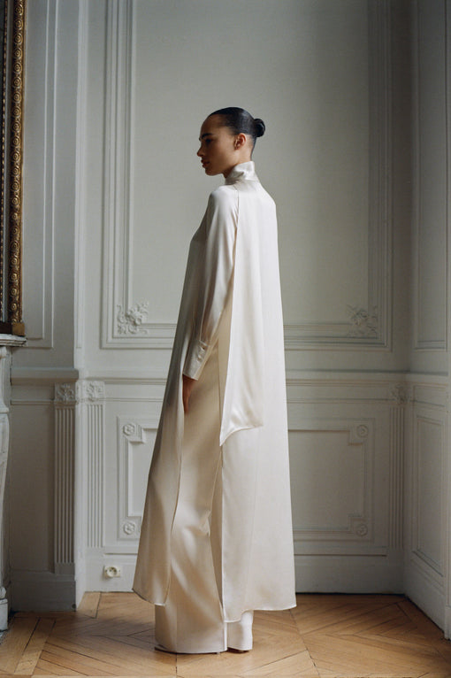 Cape-style silk dress with bow neck