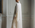 Cape-style silk dress with bow neck