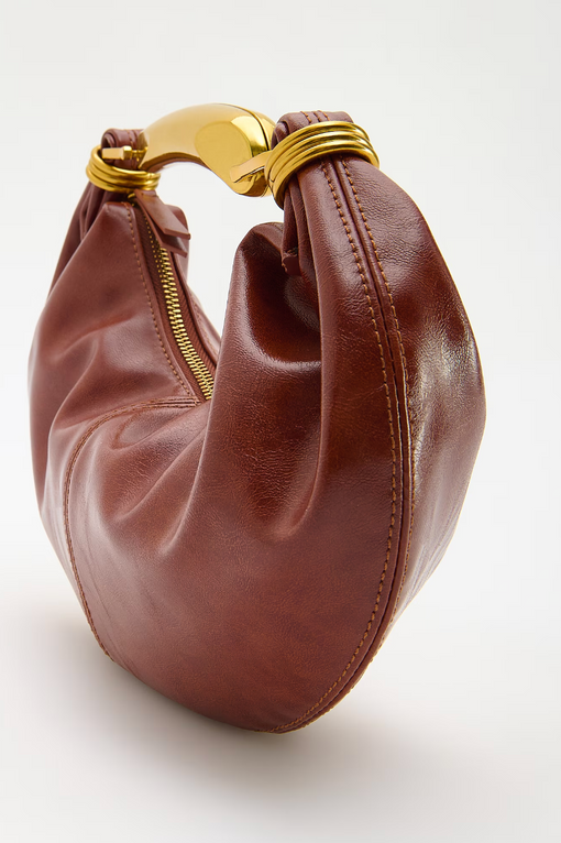 Handbag with metal handle